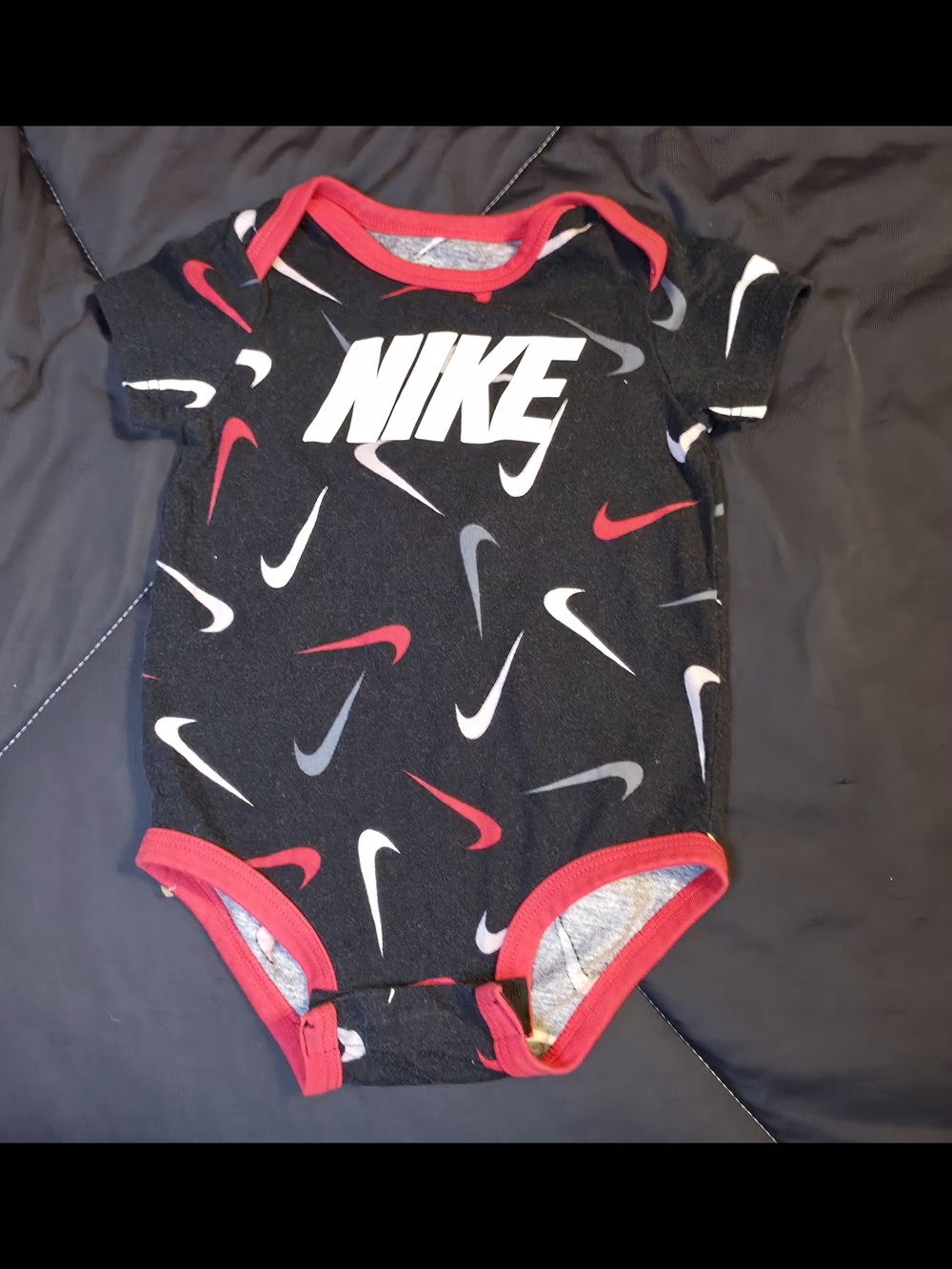 Nike Black & Red Swoosh Print Baby One-Piece